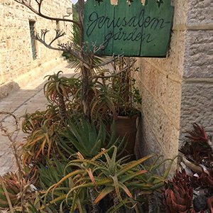 Small garden with sign reading Jerusalem garden