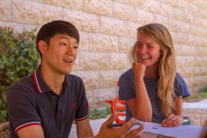 Male and female student in conversation