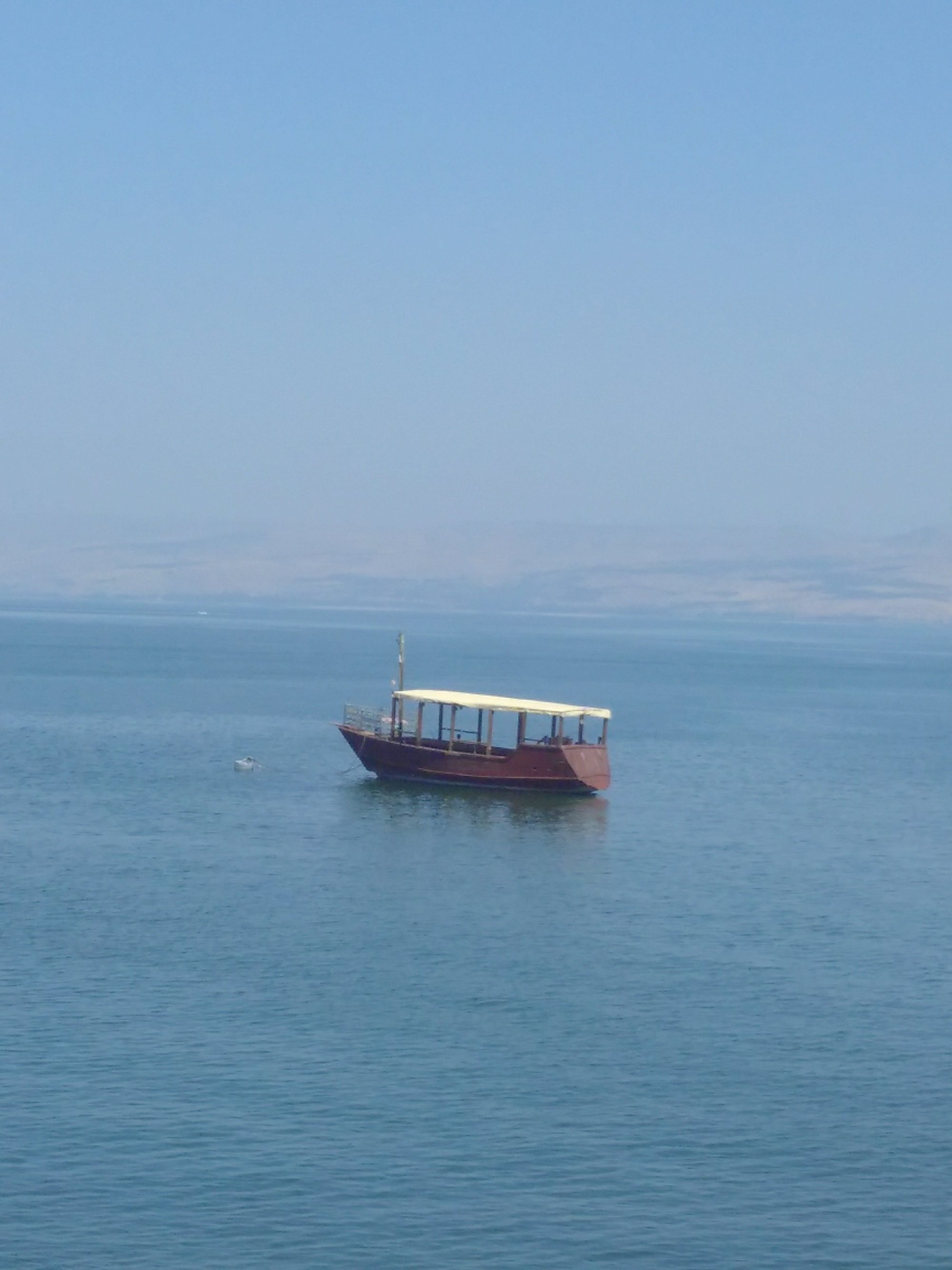 Boat floating on the Sea of Galilee